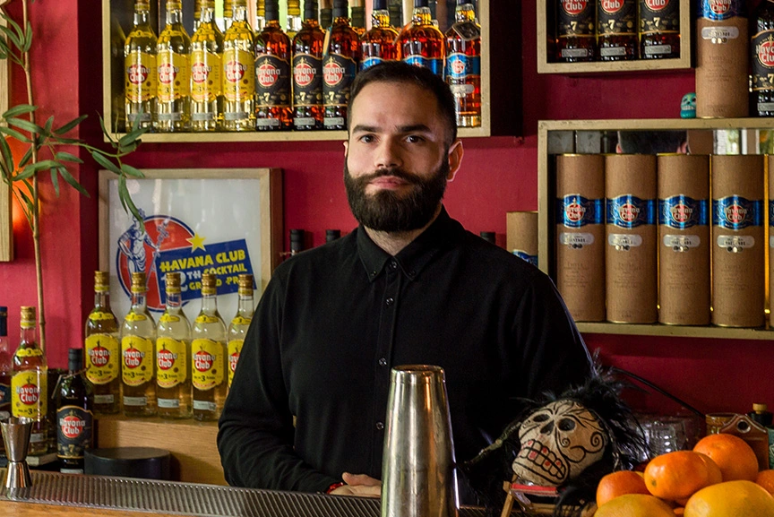 Marios Vlachakis behind the bar the likker TIKI bar